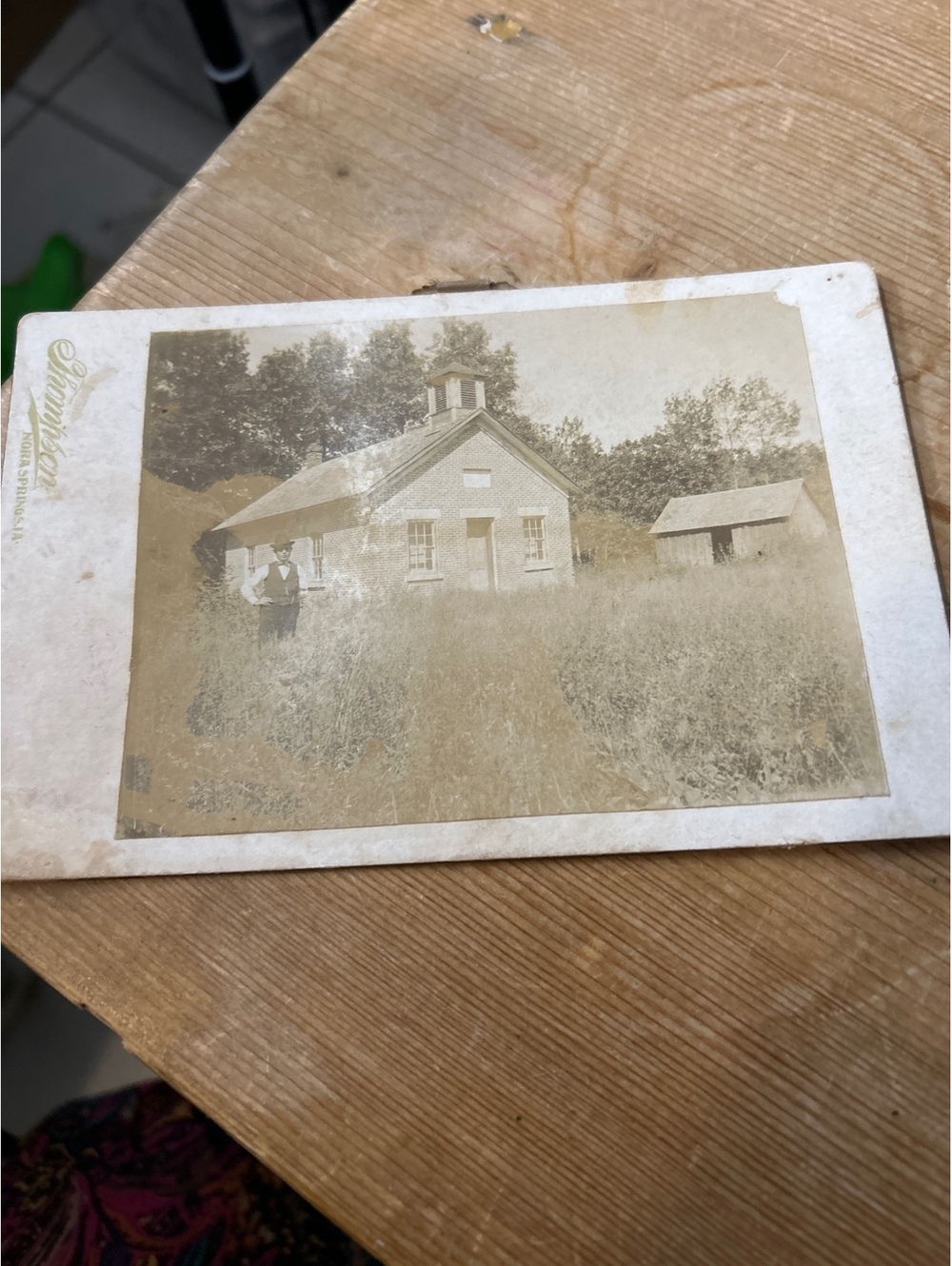 Cabinet Card with young man in a church or a school in the background
